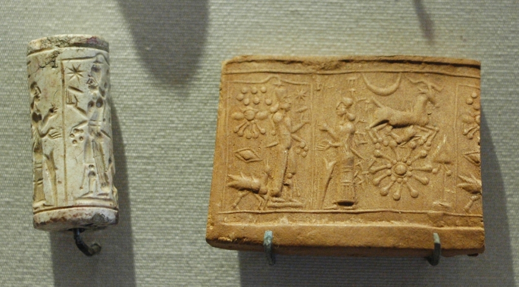A cylinder seal and its impression on clay.